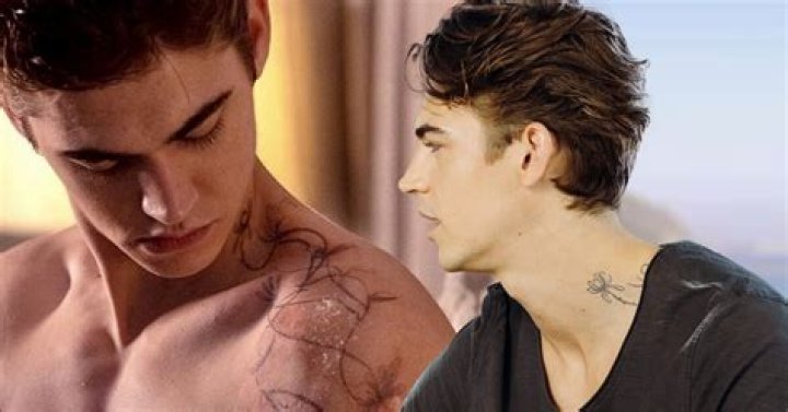 Does hero fiennes tiffin have tattoos?