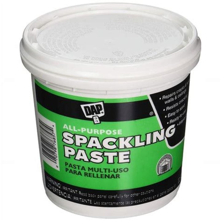 Who invented spackling paste?