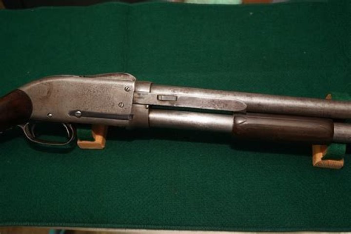 Who invented the pump action shotgun?