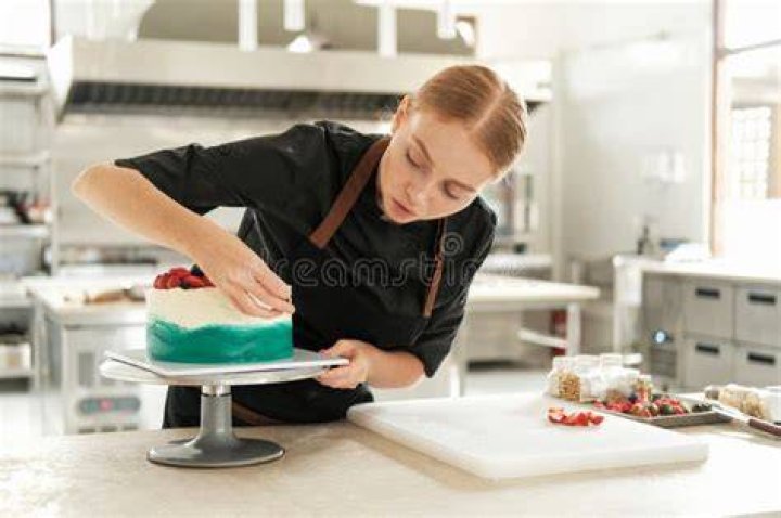 Who is decorating cakes?